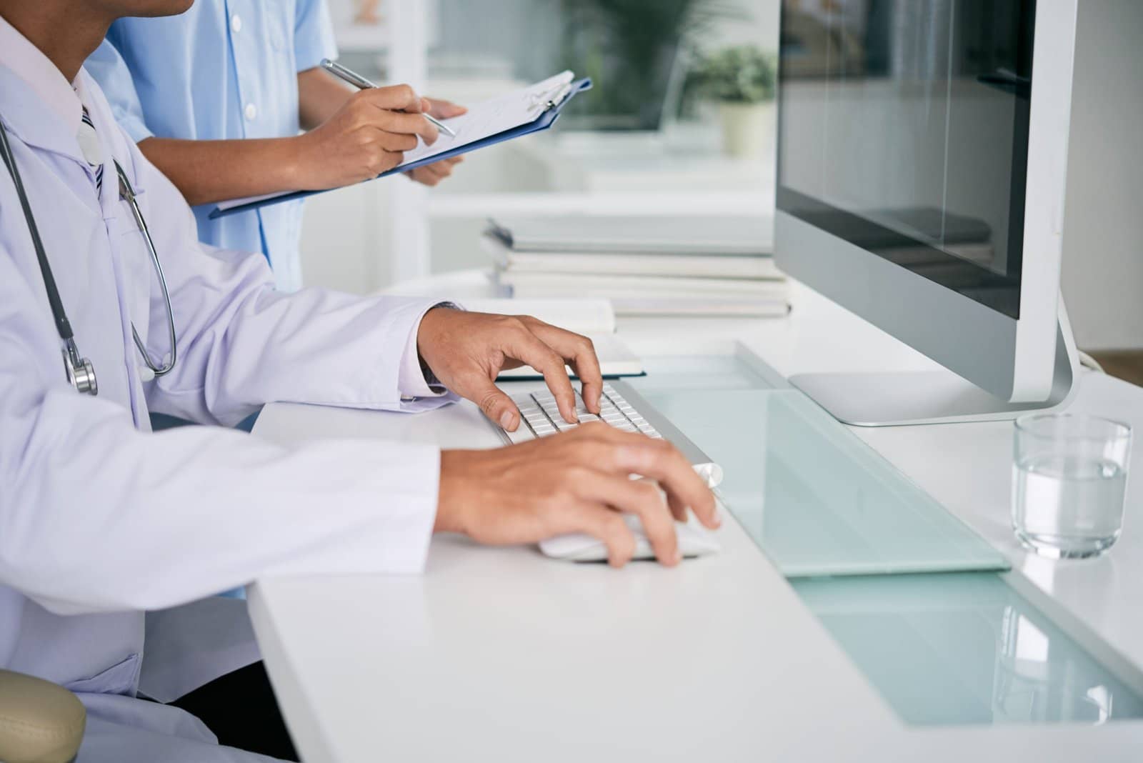 Doctor Working On Computer